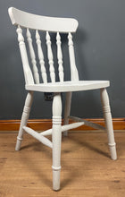 Load image into Gallery viewer, This sturdy spindle back chair is a classic style of wooden chair featuring a seat, a backrest, and a series of turned spindles that connect them.