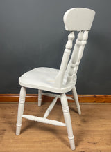 Load image into Gallery viewer, This sturdy spindle back chair is a classic style of wooden chair featuring a seat, a backrest, and a series of turned spindles that connect them.