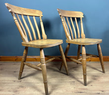 Load image into Gallery viewer, A classic design, featuring a lath back and a pleasingly shaped seat, combined with excellent build craftsmanship. The seat stands on turned legs with a single H-stretcher, making the chairs sturdy.