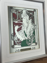 Load image into Gallery viewer, The woman’s hair, wild and swirling through a play of ornate interweaving lines, is a typical Mucha style feature. When this was created, women generally did not smoke in public and usually wore their hair up, making this a daring and wild piece. The geometric shape repeated in the background is the company’s logo.