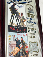 Load image into Gallery viewer, It includes a depiction of a seated Scotsman with a glass of whisky, and another scene below showing men with a cart, which are classic elements of Dewar's vintage advertising campaigns.