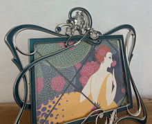 Load image into Gallery viewer, Beautiful vintage picture frame designed in the Art Deco style, featuring ornate, flowing lines and a green enamel finish. It is made from metal, likely pewter or a silver-plated alloy.