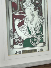 Load image into Gallery viewer, The woman’s hair, wild and swirling through a play of ornate interweaving lines, is a typical Mucha style feature. When this was created, women generally did not smoke in public and usually wore their hair up, making this a daring and wild piece. The geometric shape repeated in the background is the company’s logo.
