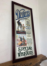 Load image into Gallery viewer, It includes a depiction of a seated Scotsman with a glass of whisky, and another scene below showing men with a cart, which are classic elements of Dewar's vintage advertising campaigns.