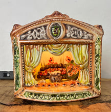 Load image into Gallery viewer, This style of hand-painted, glazed ceramic item, sometimes featuring floral designs or specific scenes, has a whimsical, hand-painted design with a military theme, incorporating several small seated toy figures and a cannon figurine.