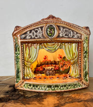 Load image into Gallery viewer, This style of hand-painted, glazed ceramic item, sometimes featuring floral designs or specific scenes, has a whimsical, hand-painted design with a military theme, incorporating several small seated toy figures and a cannon figurine.