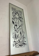 Load image into Gallery viewer, Gorgeous, vibrant Art Nouveau mirror featuring stunning, intricate designs of a beautiful lady against a floral background, with a stand-on designer branding with the famous champagne maker.