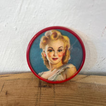 Load image into Gallery viewer, Beautiful mid-century vintage compact mirrors or small circular handbag mirrors featuring pin-up style art from the mid-20th century.