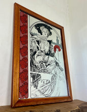 Load image into Gallery viewer, A central female figure with flowing hair, a common motif in Mucha's works. Rich, decorative elements including flowers and an ornate background, emphasizing nature's forms.