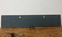 Load image into Gallery viewer, It features hand-painted or printed lettering with a bold font, often in contrasting colors like the black and silver/cream shown. The edges are sometimes aged by hand to enhance the vintage look.