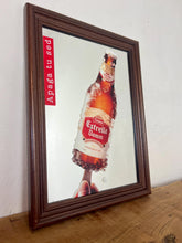 Load image into Gallery viewer, The main image is a unique graphic of an ice-encrusted Estrella Damm bottle held like a popsicle or ice lolly by a hand.