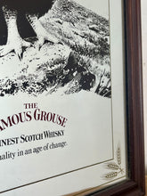 Load image into Gallery viewer, The Famous Grouse advertising wall mirror featuring the brand's iconic red grouse image and the slogan "Quality in an age of change"