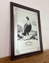 Load image into Gallery viewer, The Famous Grouse advertising wall mirror featuring the brand's iconic red grouse image and the slogan "Quality in an age of change"