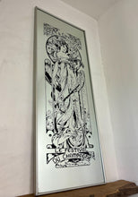 Load image into Gallery viewer, Gorgeous, vibrant Art Nouveau mirror featuring stunning, intricate designs of a beautiful lady against a floral background, with a stand-on designer branding with the famous champagne maker.