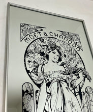 Load image into Gallery viewer, Gorgeous, vibrant Art Nouveau mirror featuring stunning, intricate designs of a beautiful lady against a floral background, with a stand-on designer branding with the famous champagne maker.