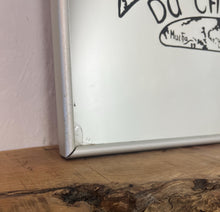 Load image into Gallery viewer, Gorgeous, vibrant Art Nouveau mirror featuring stunning, intricate designs of a beautiful lady against a floral background, with a stand-on designer branding with the famous champagne maker.