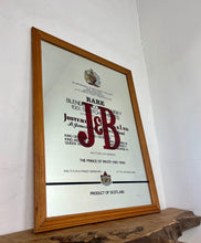 Load image into Gallery viewer, The most prominent feature is the large, bold, red "J&B" logo in a distinctive typeface.