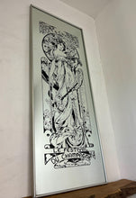 Load image into Gallery viewer, Gorgeous, vibrant Art Nouveau mirror featuring stunning, intricate designs of a beautiful lady against a floral background, with a stand-on designer branding with the famous champagne maker.