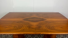 Load image into Gallery viewer, Vintage Art Deco dining table, dating from the 1930s.
The table is primarily crafted from burr walnut, often featuring highly figured or "book-matched" walnut veneers on the top surface to showcase striking natural grain patterns.