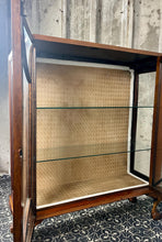Load image into Gallery viewer, This stunning piece is an antique Art Deco display cabinet, dating from the 1930s. It is characterised by its walnut or mahogany construction, featuring astragal-glazed doors with a distinctive curved pattern and claw-and-ball feet.