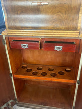 Load image into Gallery viewer, This stunning piece of furniture is an antique Art Deco cocktail cabinet, dating from the 1930’s. It is crafted from figured walnut veneer, a hallmark of the period, known for its distinctive, decorative grain patterns.
