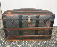 Load image into Gallery viewer, This beautiful piece is an antique dome-top (or barrel-top) steamer trunk, commonly manufactured during the late 19th century (circa 1870–1900).