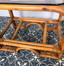 Load image into Gallery viewer, Stylish Italian pair of vintage mid-century modern bohemian bamboo-and-rattan side tables with dark, smoked glass tops.