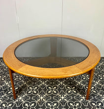 Load image into Gallery viewer, Lovely vintage chic Scandinavian coffee table which comes with an original natural light circular teak colour and smoked glass top, which creates a superb interior design.