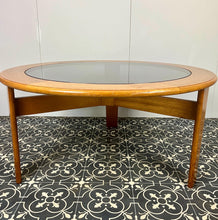 Load image into Gallery viewer, Lovely vintage chic Scandinavian coffee table which comes with an original natural light circular teak colour and smoked glass top, which creates a superb interior design.