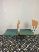 Load image into Gallery viewer, They are introducing a stylish and functional set of chairs from Kusch+Co. The teal blue/green colour adds a touch of retro elegance to any kitchen or dining room. At the same time, the 1970s hairpin legs and atomic-inspired backrests