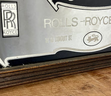 Load image into Gallery viewer, I see an advertisement featuring a sleek silver Rolls Royce car against a black background, complete with the iconic Rolls Royce logo. It looks very elegant and stylish.
