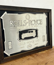 Load image into Gallery viewer, I see an advertisement featuring a sleek silver Rolls Royce car against a black background, complete with the iconic Rolls Royce logo. It looks very elegant and stylish.