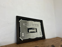 Load image into Gallery viewer, I see an advertisement featuring a sleek silver Rolls Royce car against a black background, complete with the iconic Rolls Royce logo. It looks very elegant and stylish.