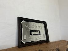 Load image into Gallery viewer, I see an advertisement featuring a sleek silver Rolls Royce car against a black background, complete with the iconic Rolls Royce logo. It looks very elegant and stylish.