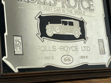 Load image into Gallery viewer, I see an advertisement featuring a sleek silver Rolls Royce car against a black background, complete with the iconic Rolls Royce logo. It looks very elegant and stylish.