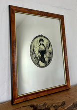 Load image into Gallery viewer, The mirror depicts a glamorous Victorian lady in an oval design with a noir effect, and it includes intricate details and a provocative finish. The walnut frame is of high quality and dates back to the 1920s.
