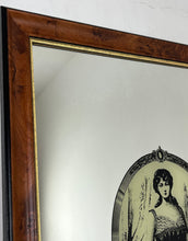 Load image into Gallery viewer, The mirror depicts a glamorous Victorian lady in an oval design with a noir effect, and it includes intricate details and a provocative finish. The walnut frame is of high quality and dates back to the 1920s.