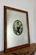 Load image into Gallery viewer, The mirror depicts a glamorous Victorian lady in an oval design with a noir effect, and it includes intricate details and a provocative finish. The walnut frame is of high quality and dates back to the 1920s.