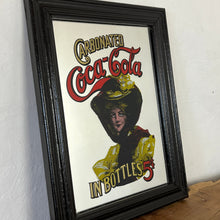 Load image into Gallery viewer, The beautiful mirror had a square picture with a Victorian lady in stylish evening clothing, the brand and fonts and a beautiful, vibrant, colourful text in gold and red. The border is a square design with lovely, vivid details.