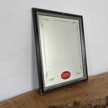 Load image into Gallery viewer, It features an oval logo of the famous pub branding in a matt red, an intricate Victorian-style gold border, and a darker wooden frame.