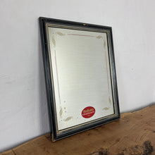 Load image into Gallery viewer, It features an oval logo of the famous pub branding in a matt red, an intricate Victorian-style gold border, and a darker wooden frame.
