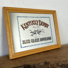 Load image into Gallery viewer, features a horse racing design. The branding is depicted in bold, vivid fonts in red and blue, and there is an intricate picture of a horse race along with a blue floral border.