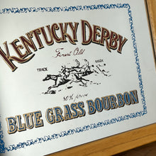 Load image into Gallery viewer, features a horse racing design. The branding is depicted in bold, vivid fonts in red and blue, and there is an intricate picture of a horse race along with a blue floral border.