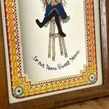 Load image into Gallery viewer, The mirror depicts Miss Petticoat in vibrant colours and would make a great addition to any art collection. Intricate, vivid border, welcome to our home sweet home.
