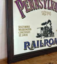 Load image into Gallery viewer, Historical Pennsylvania Railroad Company 1874 advertising mirror, showing the detailed steam train in a intricate noir design, bold stand out font with multiple vivid tones, with a list of the cities where the station are located.