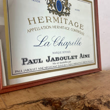 Load image into Gallery viewer, Paul Jaboulet Aine La Chapelle wine advertising mirror in an elegant design of the famous French exclusive wine producer with multiple classy fonts on the branding with the intricate gold motif logo and a sleek gold and black border.
