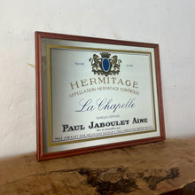 Load image into Gallery viewer, Paul Jaboulet Aine La Chapelle wine advertising mirror in an elegant design of the famous French exclusive wine producer with multiple classy fonts on the branding with the intricate gold motif logo and a sleek gold and black border.
