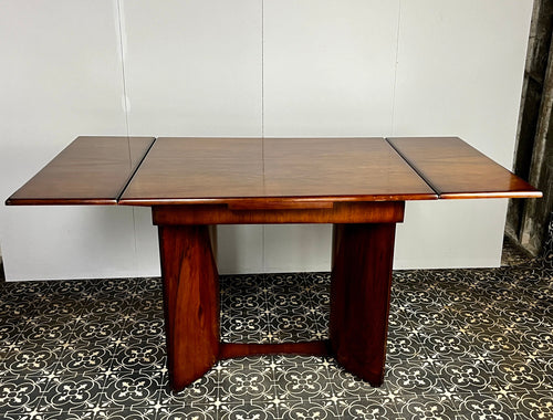 A beautiful walnut extending dining table. Art Deco in period & style around the 1930s era, craftmanship made and solid with a vibrant, attractive sheen, the workings of the extension in wonderful condition.