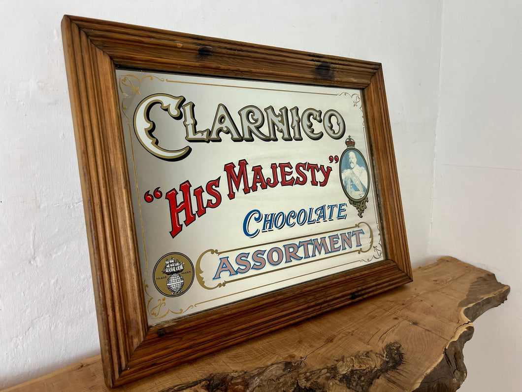 The Clarnico mirror displays a beautiful chocolate collection with a bold font and a detailed image of the king with a crown.