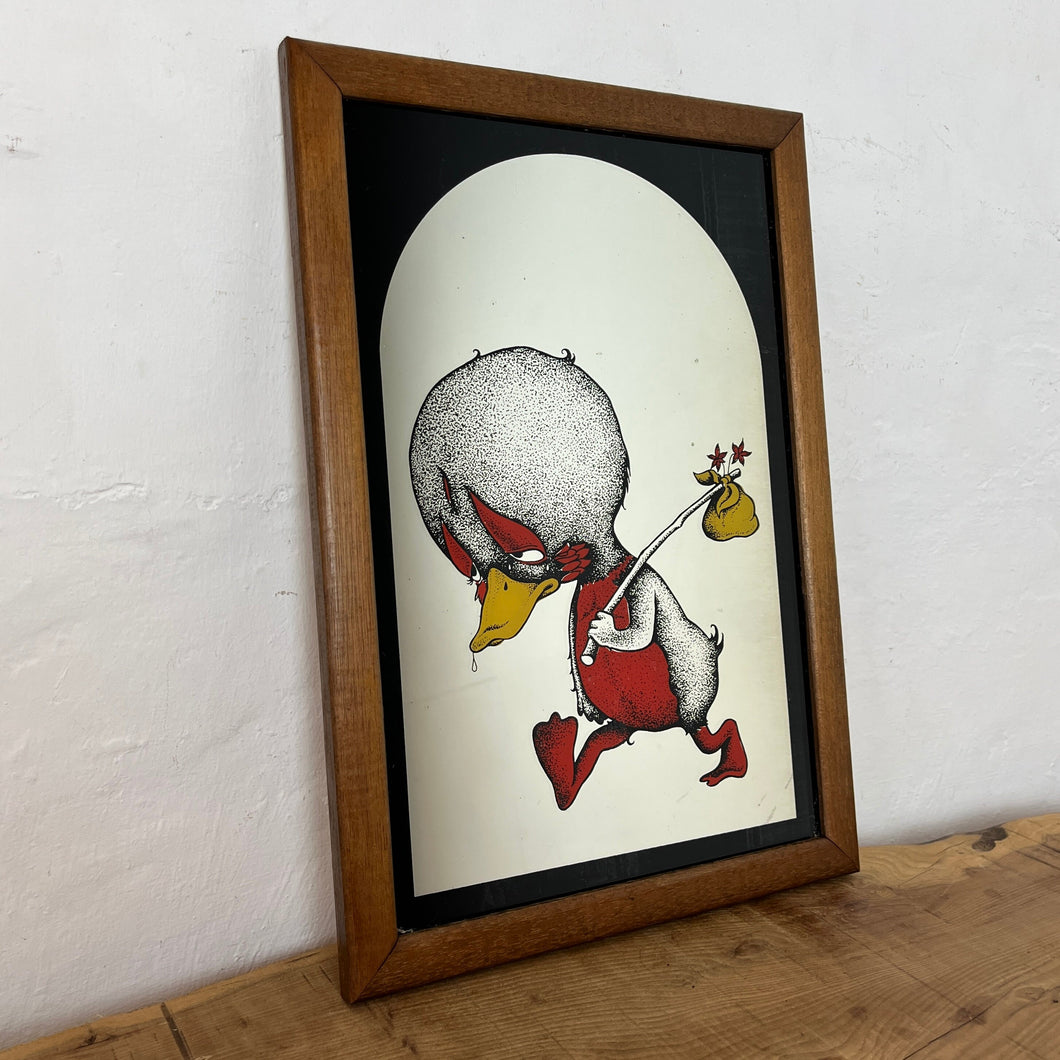 The image is printed on the back of the mirror and shows through to the front, featuring the sad duck in vibrant red and yellow, holding his hobo bag with a noir arched background.